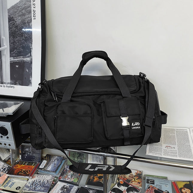 Black Unisex Travel Bag with Utility Buckles and Wet/Dry Compartments.