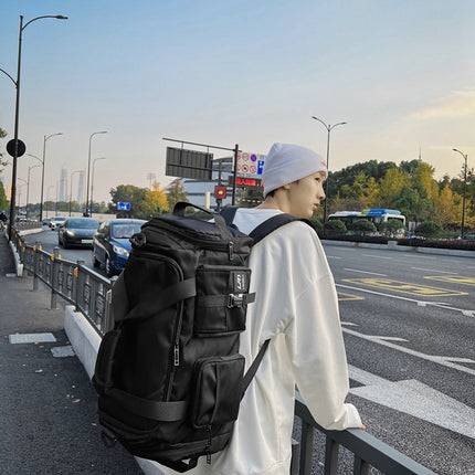 Black Unisex Travel Bag with Utility Buckles and Wet/Dry Compartments.