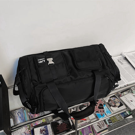 Black Unisex Travel Bag with Utility Buckles and Wet/Dry Compartments.