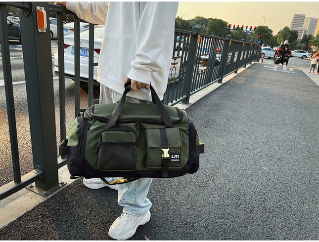 Green Unisex Travel Bag with Utility Buckles and Wet/Dry Compartments.