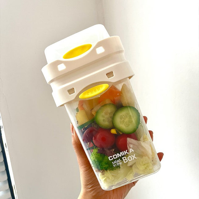 White Portable salad cup with ingredient compartment and fork and spoon - enjoy breakfast on the go.