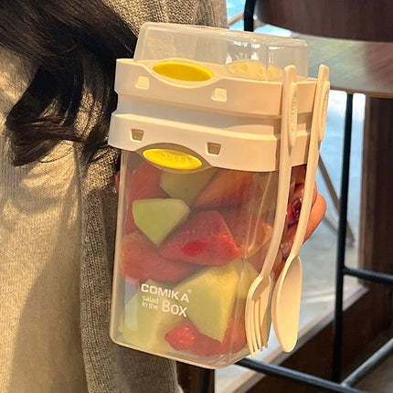 White Portable salad cup with ingredient compartment and fork and spoon - enjoy breakfast on the go.