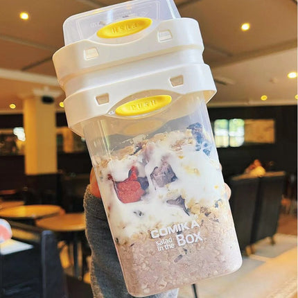 White Portable salad cup with ingredient compartment and fork and spoon - enjoy breakfast on the go.