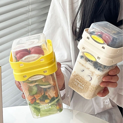 Yellow Portable salad cup with ingredient compartment and fork and spoon - enjoy breakfast on the go.