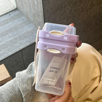 Purple Portable salad cup with ingredient compartment and fork and spoon - enjoy breakfast on the go.