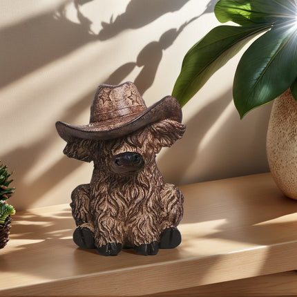 Rustic Highland Cow Statue with Cowboy Hat - Resin Farmhouse Decor.