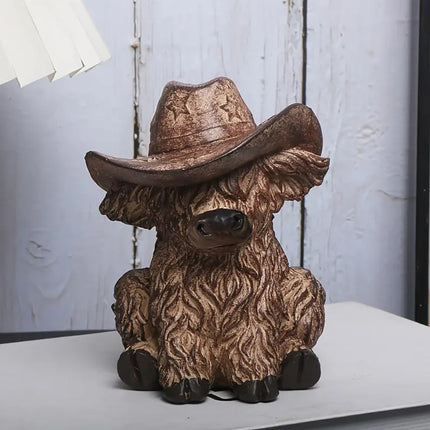 Rustic Highland Cow Statue with Cowboy Hat - Resin Farmhouse Decor.