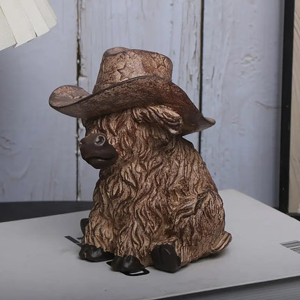 Rustic Highland Cow Statue with Cowboy Hat - Resin Farmhouse Decor.