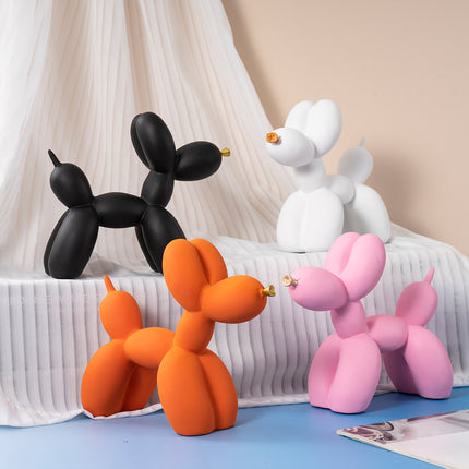 Orange Modern Resin Balloon Dog Sculpture - Playful Art Figurine with Golden Snout Accent.