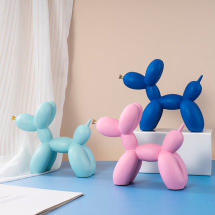 Orange Modern Resin Balloon Dog Sculpture - Playful Art Figurine with Golden Snout Accent.