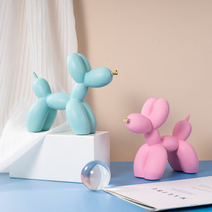Orange Modern Resin Balloon Dog Sculpture - Playful Art Figurine with Golden Snout Accent.