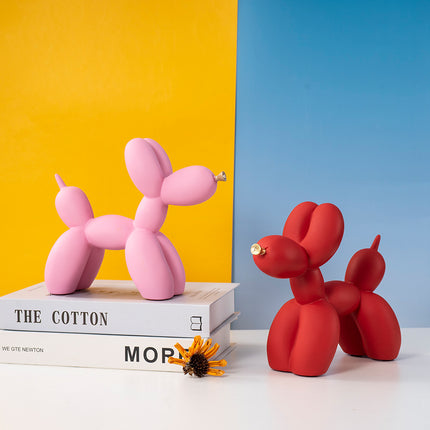 Orange Modern Resin Balloon Dog Sculpture - Playful Art Figurine with Golden Snout Accent.