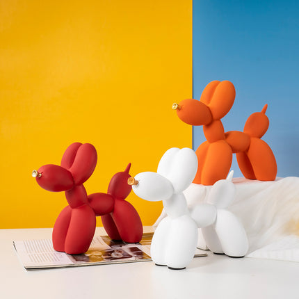 Orange Modern Resin Balloon Dog Sculpture - Playful Art Figurine with Golden Snout Accent.