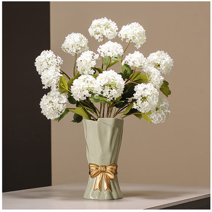 Beige Elegant Ceramic Vase with Golden Bow Accent - Textured Relief Flower Holder for Living Room & Dining Table Decor.