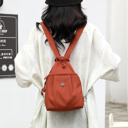 Orange Versatile Women's Convertible Mini Backpack & Sling Bag - Stylish Anti-Theft Oxford Cloth Daypack, Fits 9.7in iPad.
