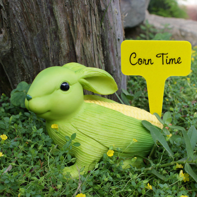 Green And Yellow Whimsical Resin Corn Rabbit Garden Statue - Unique Outdoor Yard Art Figurine with Decorative Sign.