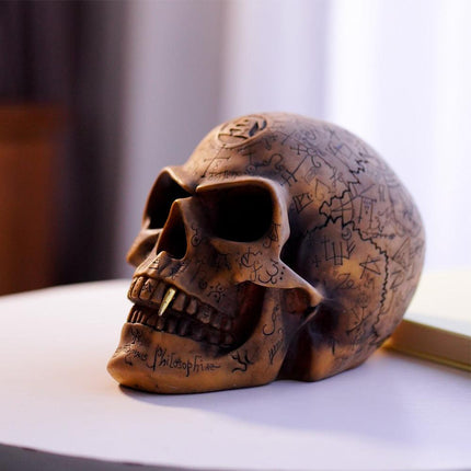 Mystic Runic Skull Statue with Gold Fang - Hand-Painted Resin Figurine for Gothic & Halloween Decor.