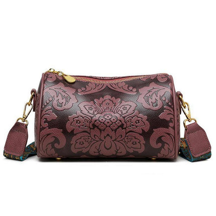 Dark Purple Vintage Embossed Crossbody Barrel Bag with Wide Adjustable Guitar Strap.