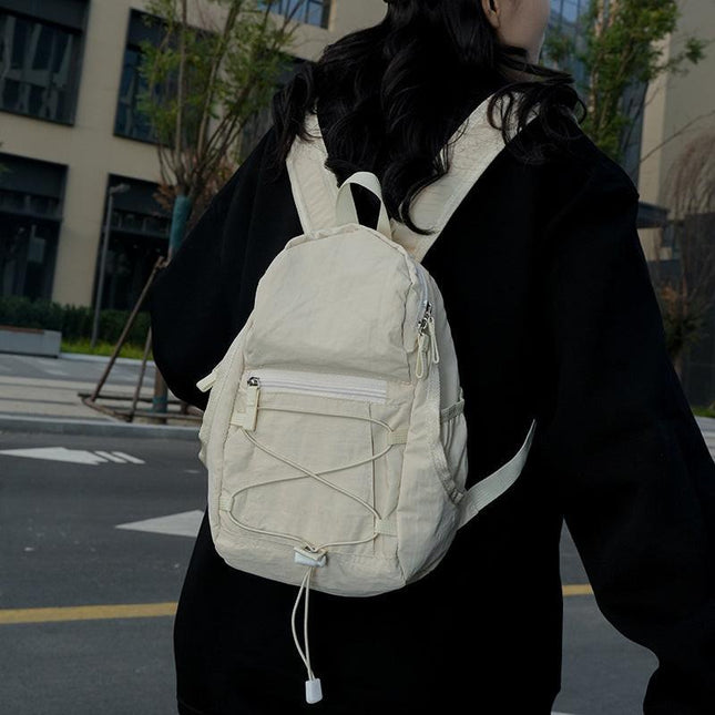 White Mini Lightweight Drawstring Backpack for Women - Small Casual Travel Daypack.