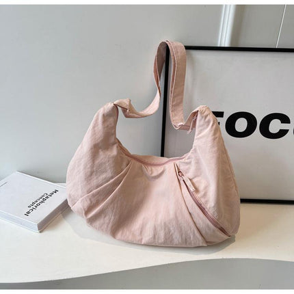 Pink Lightweight Crescent Crossbody Bag - Slouchy Nylon Hobo Purse for Casual Everyday Use.