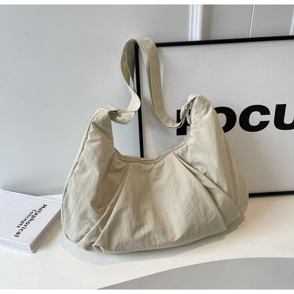 Beige Lightweight Crescent Crossbody Bag - Slouchy Nylon Hobo Purse for Casual Everyday Use.