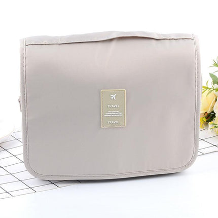 Beige Portable Hanging Travel Toiletry Bag - Large Capacity Cosmetic & Wash Organizer with Sturdy Hook.