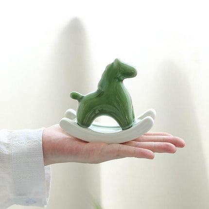 Green Modern Ceramic Rocking Horse Ornament - Cute Porcelain Figurine for Desk & Shelf Decor.
