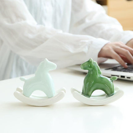Light Green Modern Ceramic Rocking Horse Ornament - Cute Porcelain Figurine for Desk & Shelf Decor.