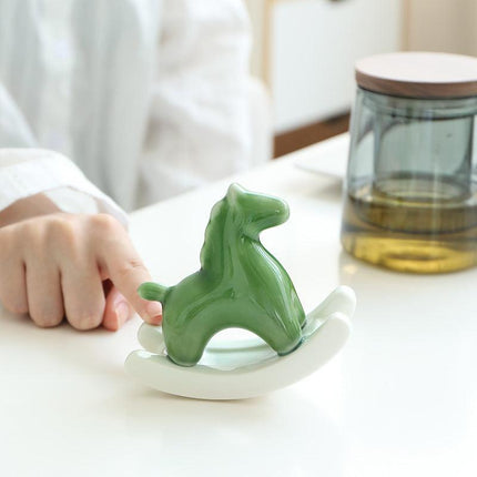 Pink Modern Ceramic Rocking Horse Ornament - Cute Porcelain Figurine for Desk & Shelf Decor.