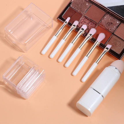Wine Red Compact 8-in-1 Makeup Brush Set - Portable Travel Kit with Retractable Brushes and Case.
