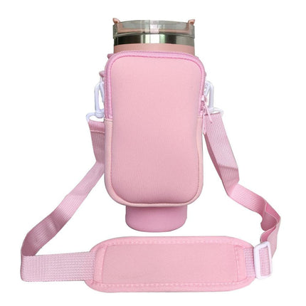Pink Crossbody Tumbler Carrier with Detachable Wallet Pouch and Adjustable Strap.