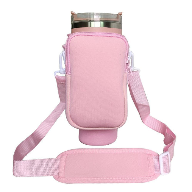 Pink Crossbody Tumbler Carrier with Detachable Wallet Pouch and Adjustable Strap.