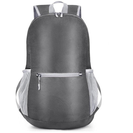Grey Ultra Lightweight Foldable Backpack Packable Daypack Compact Travel Rucksack with Mesh Pockets Ideal for Outdoor Adventures.