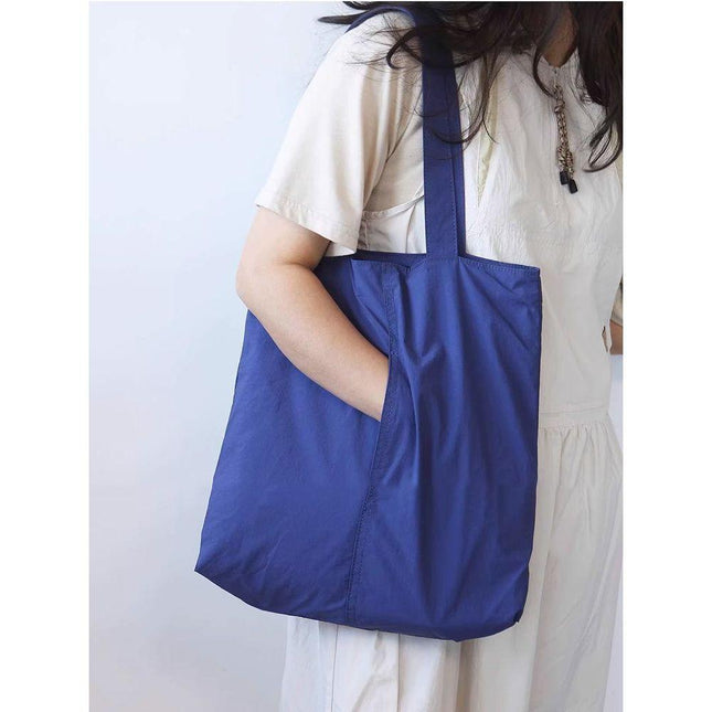 Blue Women's Minimalist Nylon Tote Bag Ultra Lightweight Shoulder Shopper Large Capacity Fits A4 Documents for Work and School.