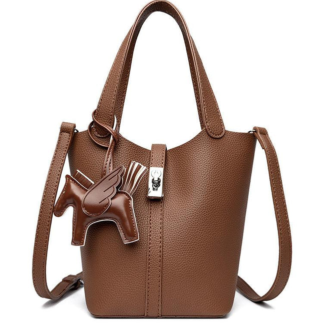 Brown Women's Small PU Leather Bucket Bag with Secure Lock and Horse Charm - 20cm Compact Crossbody Handbag for Everyday Use.