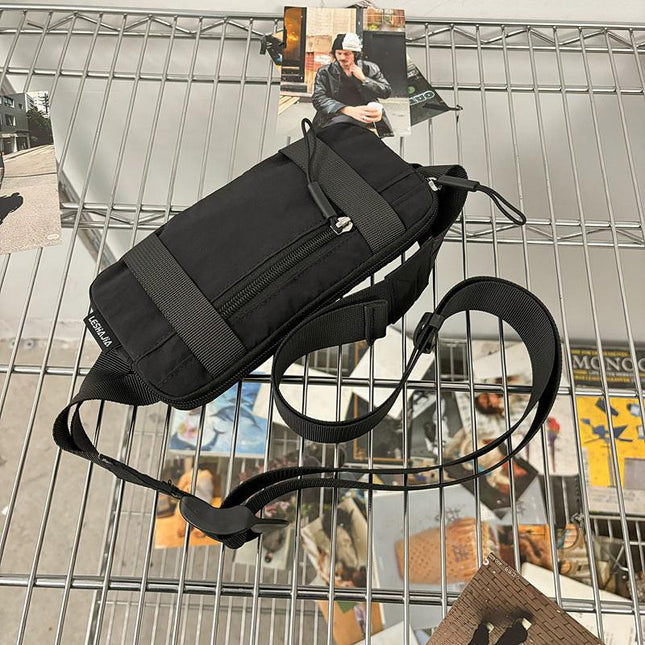 Black Unisex Mini Crossbody Waist Bag Lightweight Nylon Running Belt Phone Pouch 21cm Slim Sports Chest Sling for Travel & Gym.