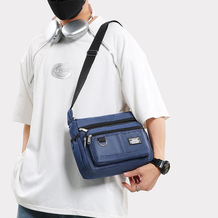 Dark Blue Men's Waterproof Oxford Cloth Crossbody Bag - Durable Anti-Theft Shoulder Backpack for Business, Travel & 10-inch Tablet.