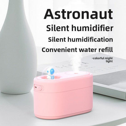 Pink Rechargeable Mini Astronaut Air Humidifier USB Desktop Cool Mist Humidifier with 7-Color LED Night Light for Bedroom and Office.