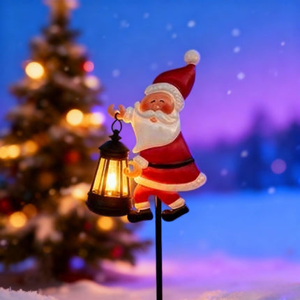 Warm white light Solar Powered Christmas Garden Stake - Metal Santa Claus with Glowing Lantern - Warm White LED Outdoor Decoration - 82cm Height.
