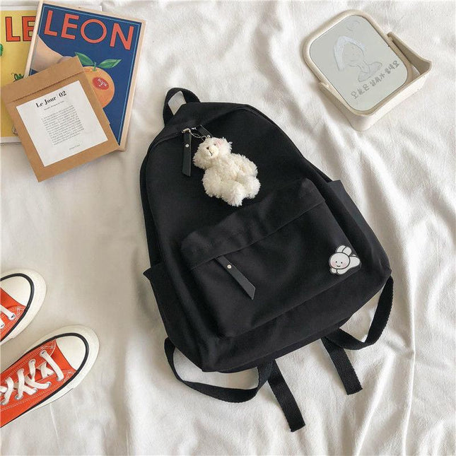 Aesthetic Black School Backpack with Cute Bear Plushie and Pin Large Capacity Nylon Laptop Daypack for High School and Uni Students.