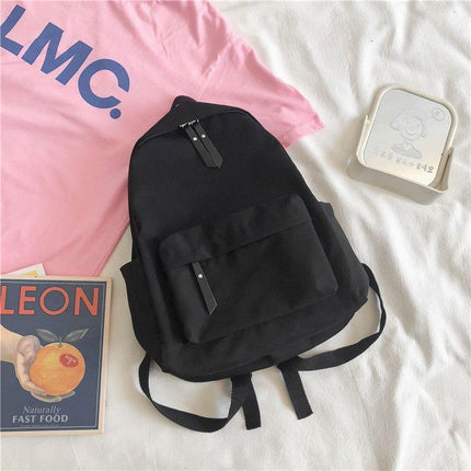 Aesthetic Black School Backpack with Cute Bear Plushie and Pin Large Capacity Nylon Laptop Daypack for High School and Uni Students.
