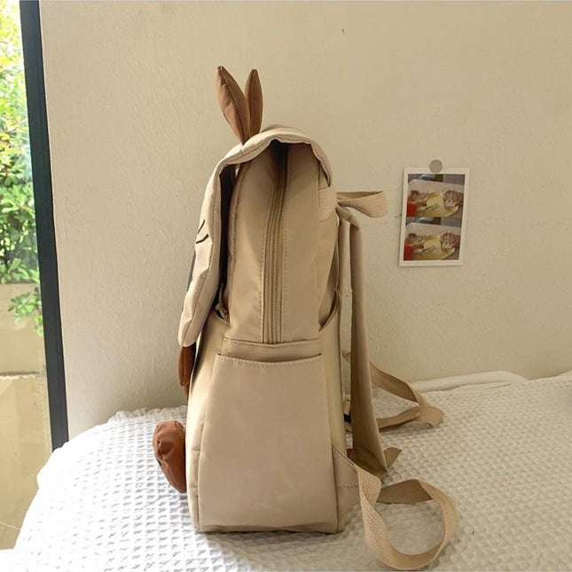 Khaki Lightweight Nylon Waterproof Schoolbag for Children - Large Capacity Daypack with Ugly-Cute Cat Design.
