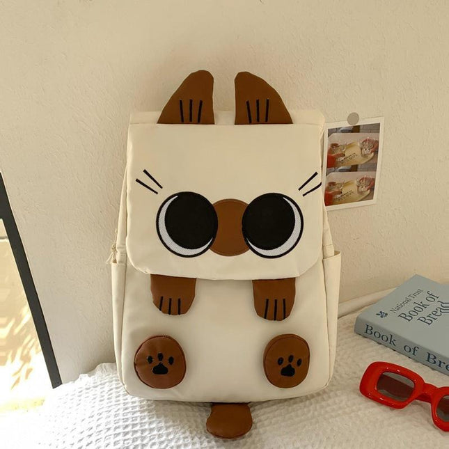 White Lightweight Nylon Waterproof Schoolbag for Children - Large Capacity Daypack with Ugly-Cute Cat Design.