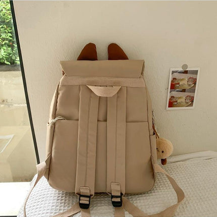 White Lightweight Nylon Waterproof Schoolbag for Children - Large Capacity Daypack with Ugly-Cute Cat Design.