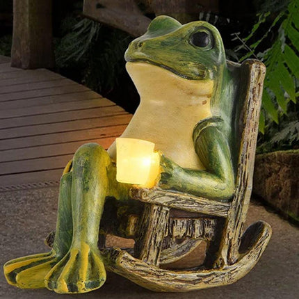 Solar Powered Rocking Chair Frog Garden Statue Resin Animal Sculpture with LED Glowing Cup for Patio Backyard Landscape Charming Decor for Local Homes.