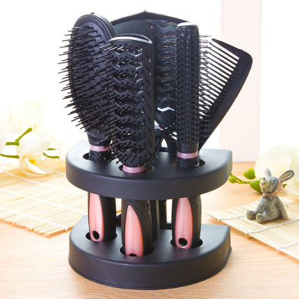 Pink 5-Piece Hair Care Set with Rotating Stand – Includes Flat Comb, Styling Brush, Massage Comb, Round Brush, and Handheld Mirror.