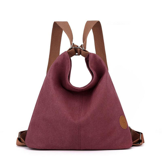 Purple Versatile 3-in-1 Canvas Backpack and Shoulder Bag Large Capacity Handbag for Women Ideal for Travel School and Everyday Use.