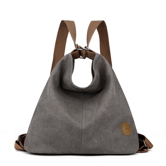 Grey Versatile 3-in-1 Canvas Backpack and Shoulder Bag Large Capacity Handbag for Women Ideal for Travel School and Everyday Use.