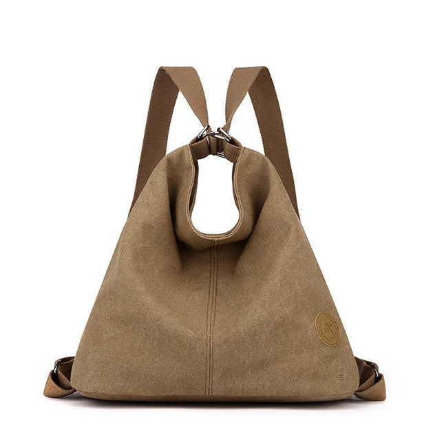 Coffee Versatile 3-in-1 Canvas Backpack and Shoulder Bag Large Capacity Handbag for Women Ideal for Travel School and Everyday Use.