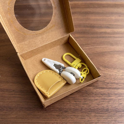 Yellow Ultra-Portable Mini Precision Scissors Set - Compact 7cm Craft Snips with Safety Cap, Leather Sheath, and Keychain Hook for Travel and DIY.